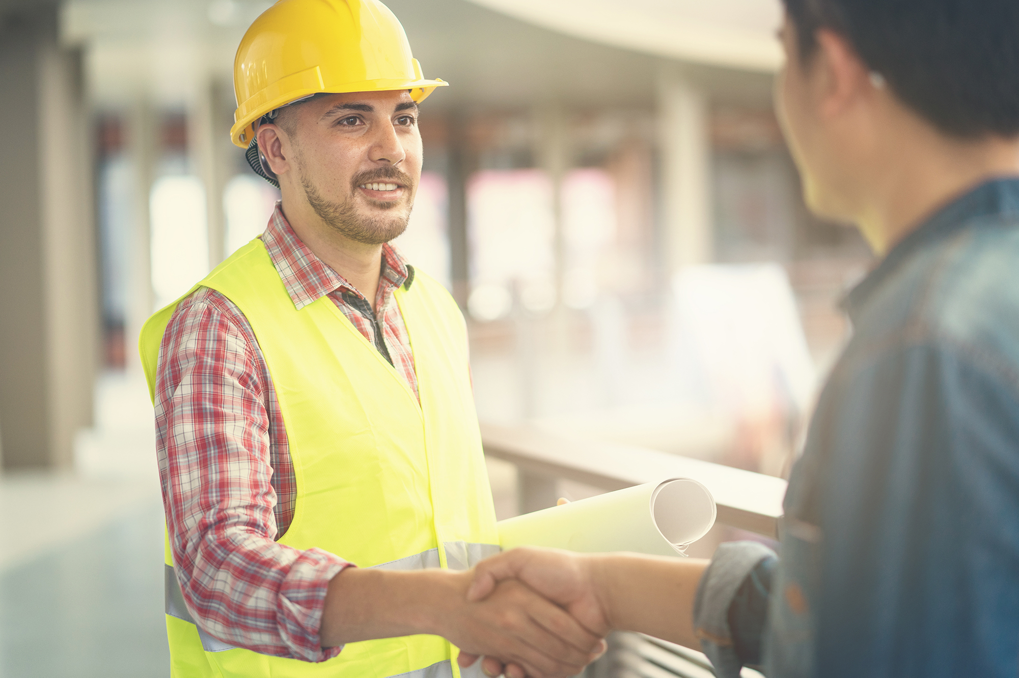 construction worker shaking hands